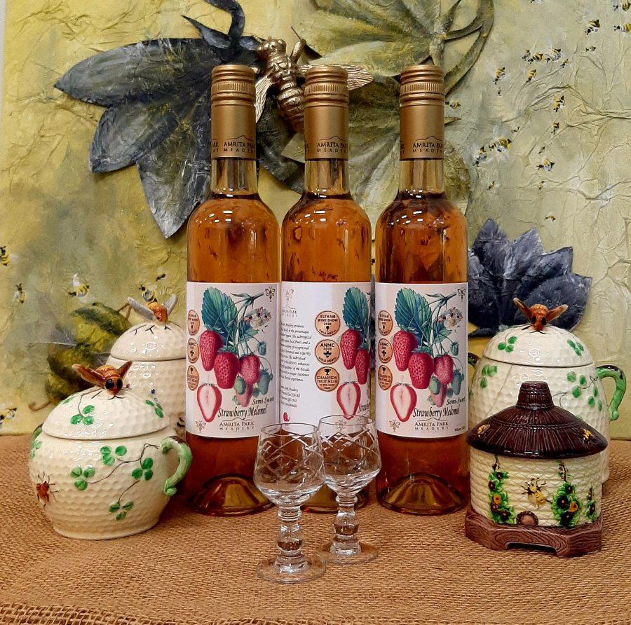 Strawberry mead 3 bottles on a table